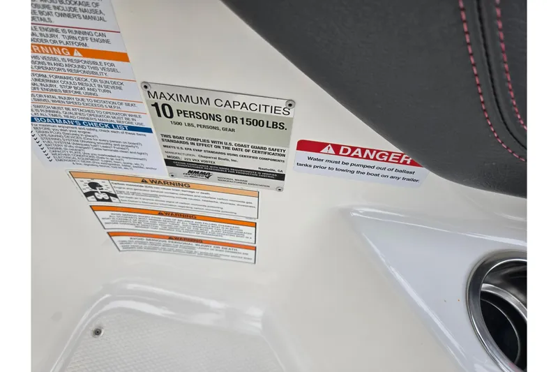Slide: The Image of 2015 Chaparral Vortex 223 VRX capacity and safety warning labels on boat interior. - 16