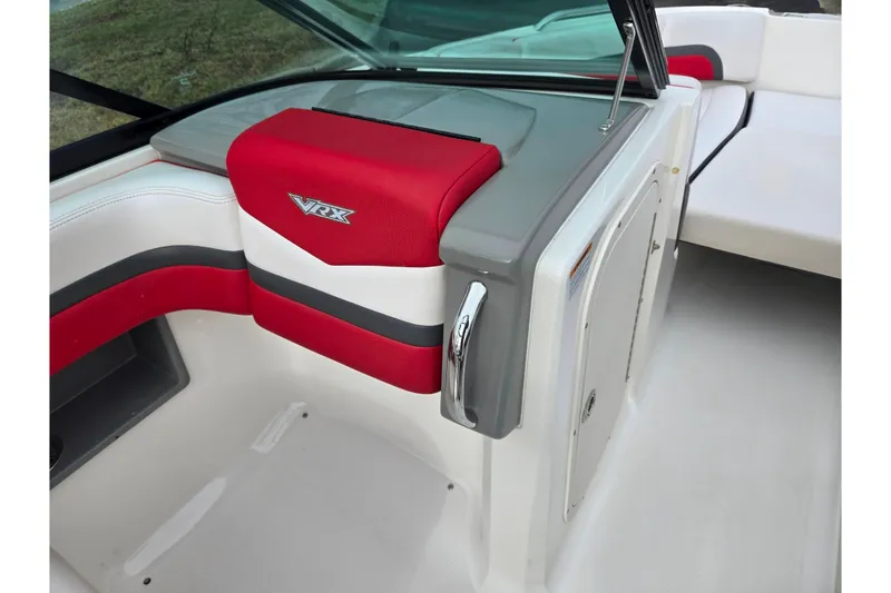Slide: The Image of 2015 Chaparral Vortex 223 VRX interior with red and gray seating detail. - 17