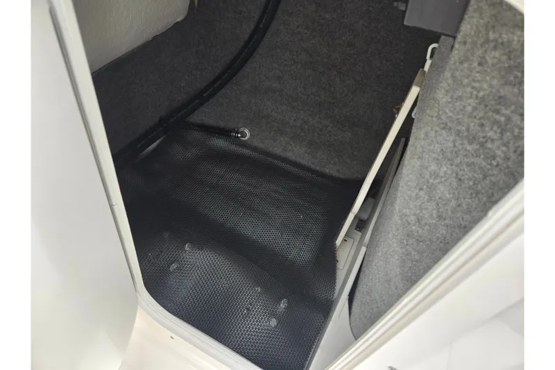 Slide: The Image of Interior storage compartment of 2015 Chaparral Vortex 223 VRX boat. - 19
