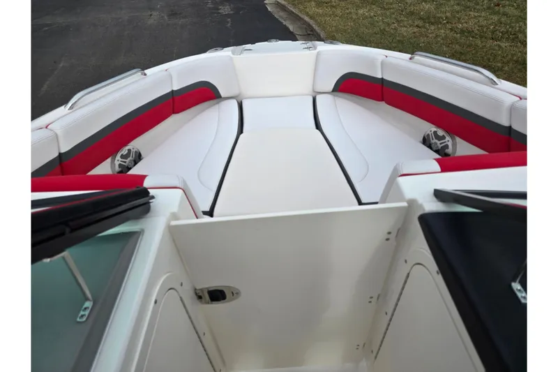 Slide: The Image of 2015 Chaparral Vortex 223 VRX boat interior with red and gray seating. - 20