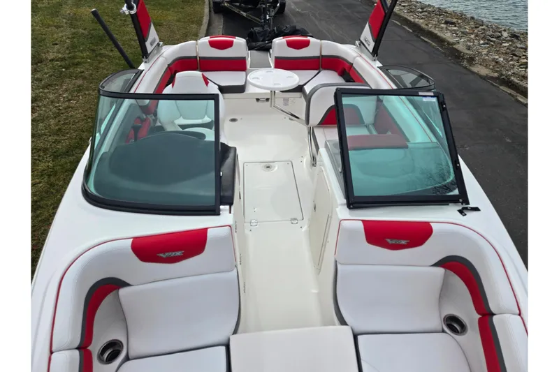 Slide: The Image of 2015 Chaparral Vortex 223 VRX boat interior with red and white seating. - 23