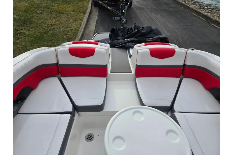 Slide: The Image of 2015 Chaparral Vortex 223 VRX boat interior with red and white seating. - 25