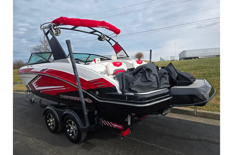 Slide: The Image of 2015 Chaparral Vortex 223 VRX boat on trailer, featuring red and white design. - 3