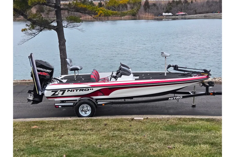 The Image of 2015 Nitro Z-7 boat with Mercury engine by a lakeside. - 0