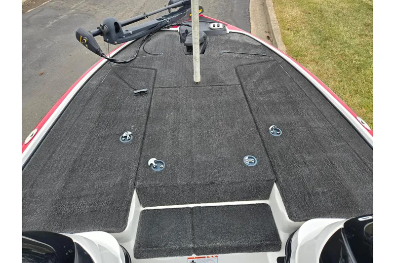 Slide: The Image of 2015 Nitro Z-7 boat deck with trolling motor and storage compartments. - 13
