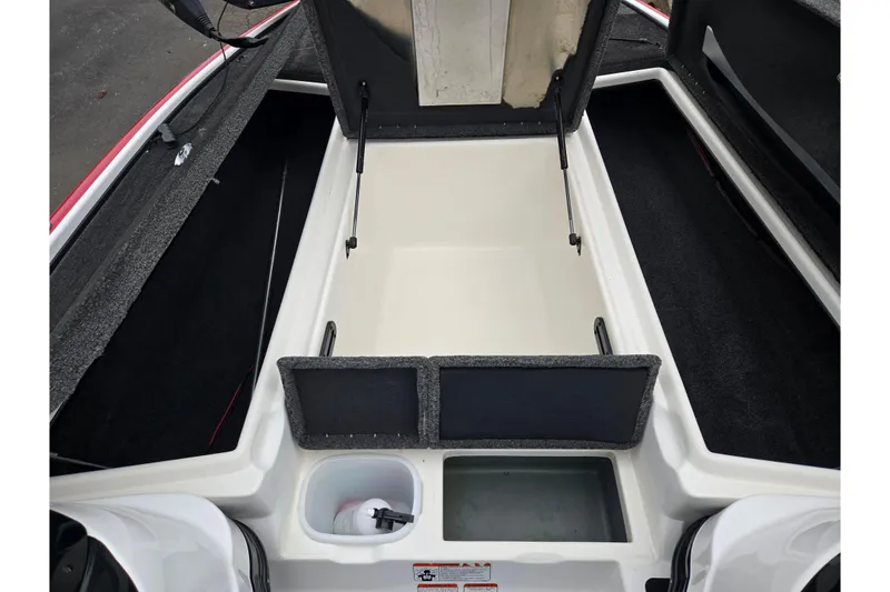 Slide: The Image of 2015 Nitro Z-7 boat storage compartment with open lid, showcasing interior space. - 16