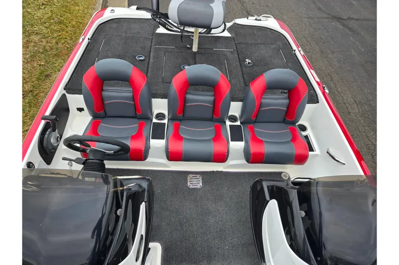 Slide: The Image of 2015 Nitro Z-7 boat interior with red and gray seats, steering wheel, and storage compartments. - 20