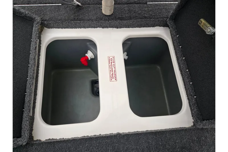 Slide: The Image of 2015 Nitro Z-7 boat livewell compartments with red and white valves. - 23
