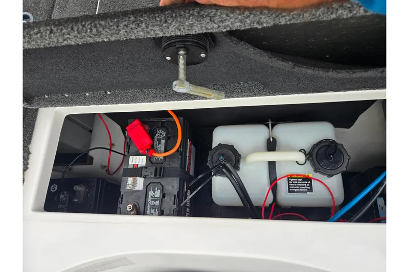 Slide: The Image of Open compartment of 2015 Nitro Z-7 boat showing batteries and fuel tanks. - 24