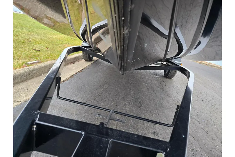 Slide: The Image of 2015 Nitro Z-7 boat on trailer, viewed from below, parked on pavement. - 7