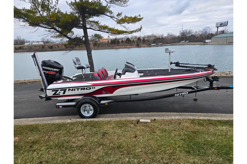 Slide: The Image of 2015 Nitro Z-7 boat with Mercury engine, parked by a lakeside. - 9
