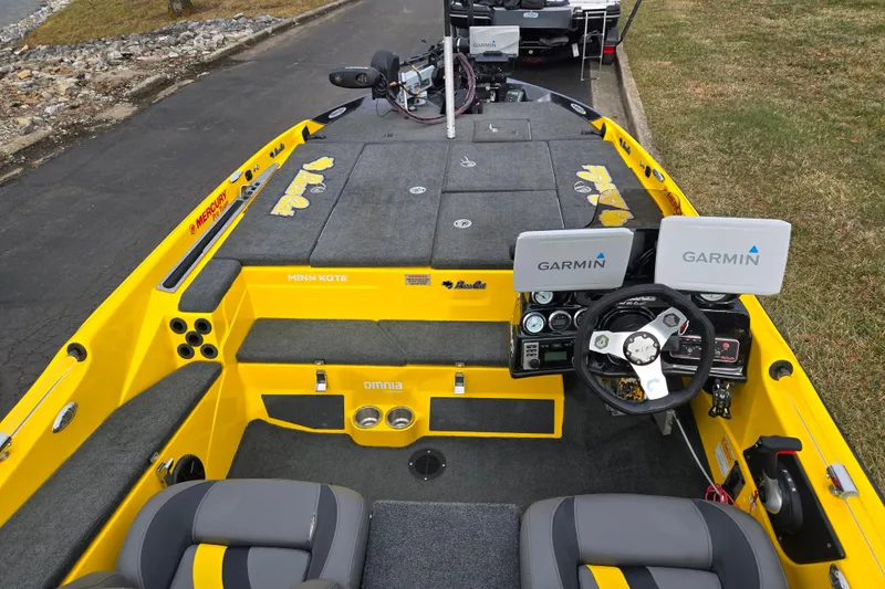 Slide: The Image of 2016 Bass Cat Caracal boat interior with Garmin displays and Minn Kota trolling motor. - 12
