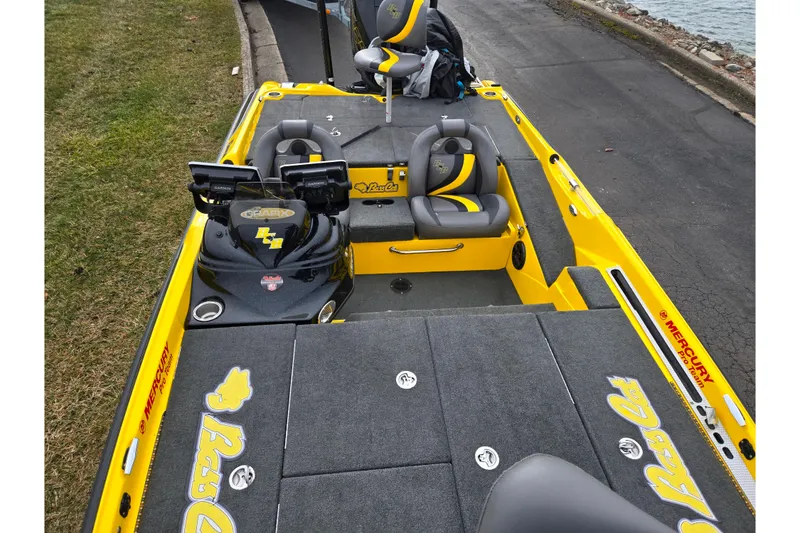 Slide: The Image of 2016 Bass Cat Caracal boat with yellow accents and dual fish finders. - 22
