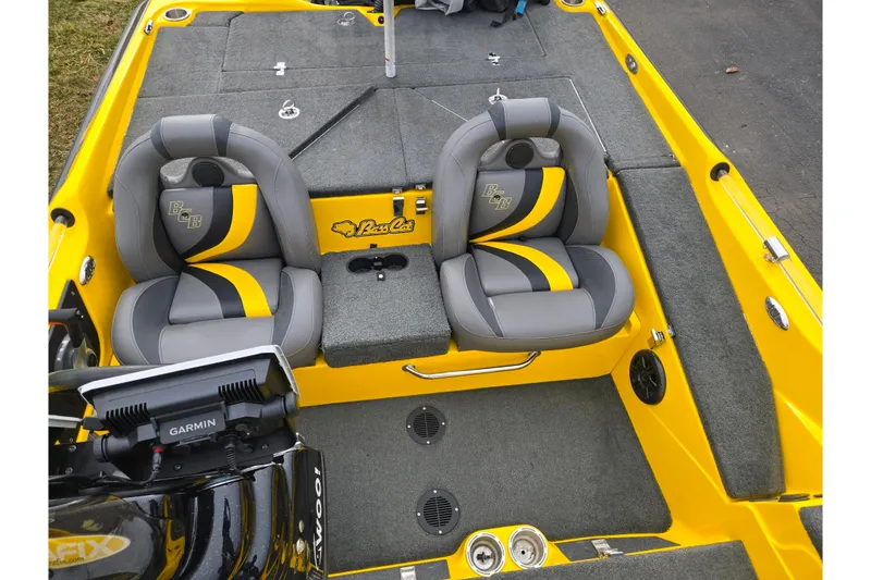 Slide: The Image of 2016 Bass Cat Caracal boat interior with yellow and gray seating, Garmin equipment. - 23