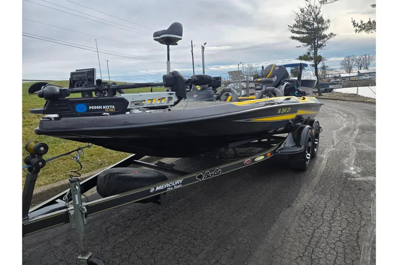 Slide: The Image of 2016 Bass Cat Caracal fishing boat on trailer with Minn Kota motor. - 5