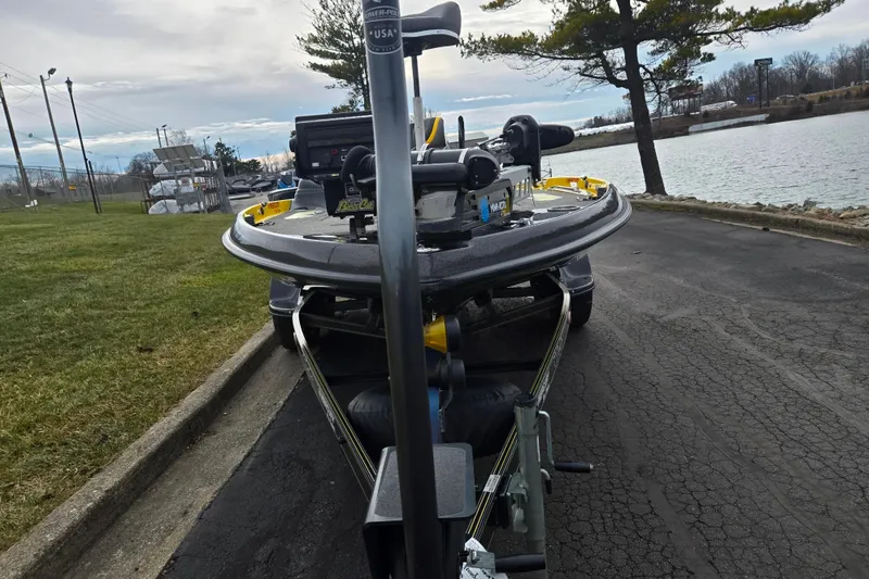 Slide: The Image of 2016 Bass Cat Caracal boat on trailer near a lake, ready for launch. - 8