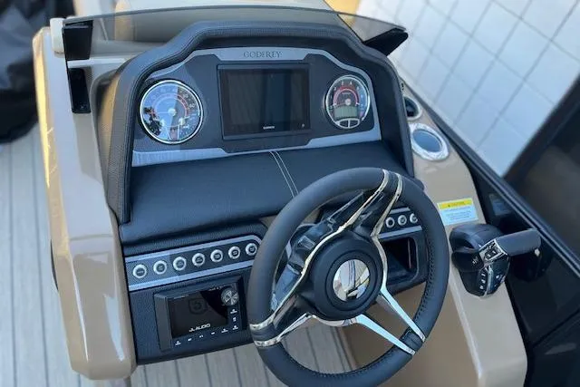 Slide: The Image of 2026 Godfrey Monaco 255 SFLC dashboard with steering wheel and control panel. - 13