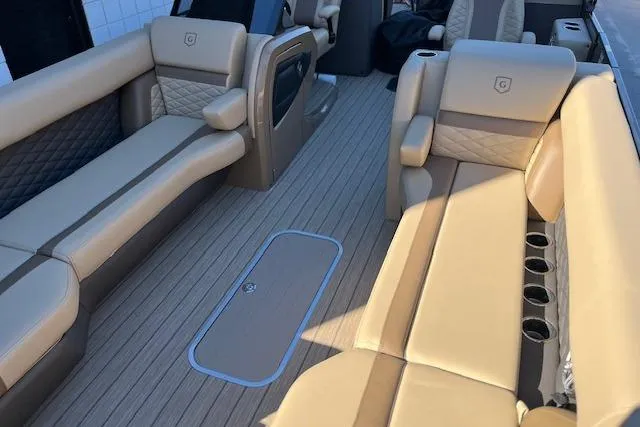 Slide: The Image of Luxurious interior of 2026 Godfrey Monaco 255 SFLC pontoon boat with beige seating. - 24