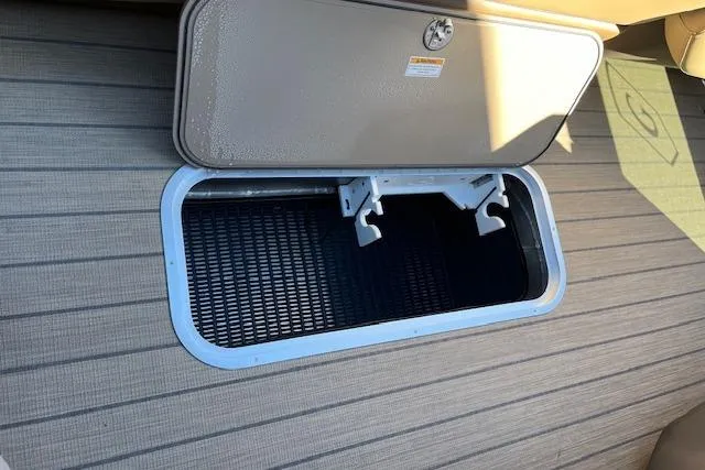 Slide: The Image of Open storage compartment on 2026 Godfrey Monaco 255 SFLC boat deck. - 28