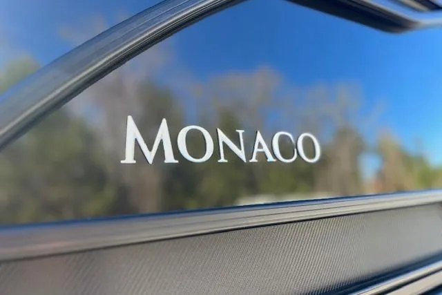 Slide: The Image of Close-up of 2026 Godfrey Monaco 255 SFLC logo on sleek exterior. - 4