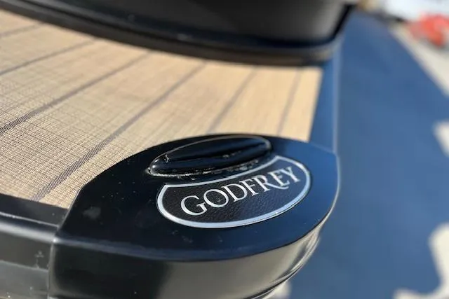 Slide: The Image of 2026 Godfrey Monaco 255 SFLC boat with sleek design and branding. - 5