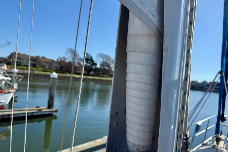 Slide: The Image of Close-up of furled mainsail on TALLY HO. Main is in great shape! - 12