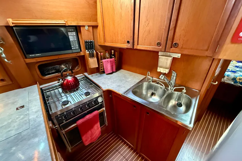 Slide: The Image of Propane range with oven, great counter space, under deck refrigeration and double stainless steel sinks - 29