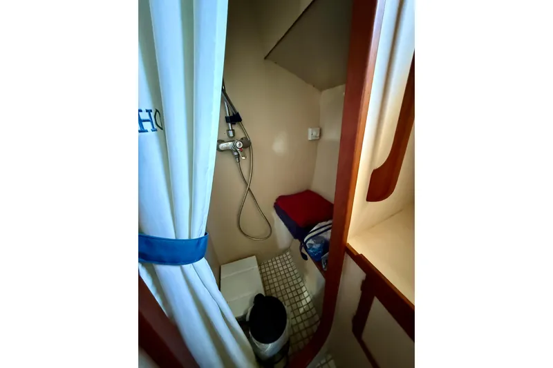Slide: The Image of Stall shower with seat and curtain. - 38