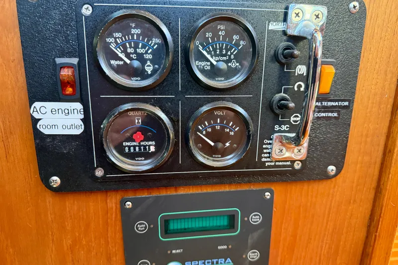 Slide: The Image of Control panel of a 1986 Nauticat 43 boat with gauges and switches. - 45
