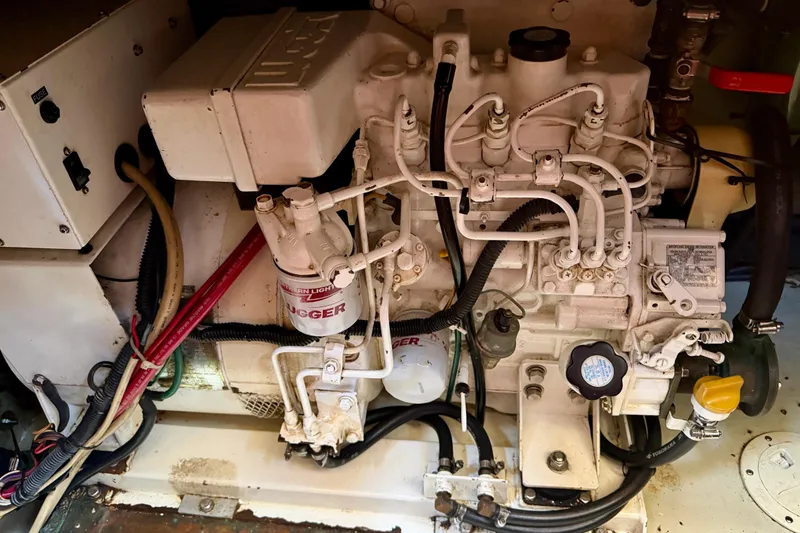 Slide: The Image of Engine compartment of a 1986 Nauticat 43 sailboat, showcasing detailed mechanical components. - 47