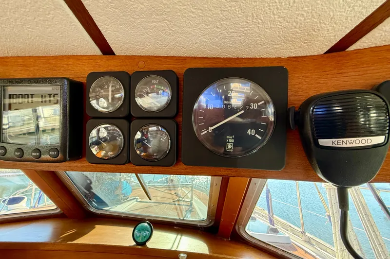 Slide: The Image of Control panel of a 1986 Nauticat 43 sailboat with gauges and Kenwood radio. - 50