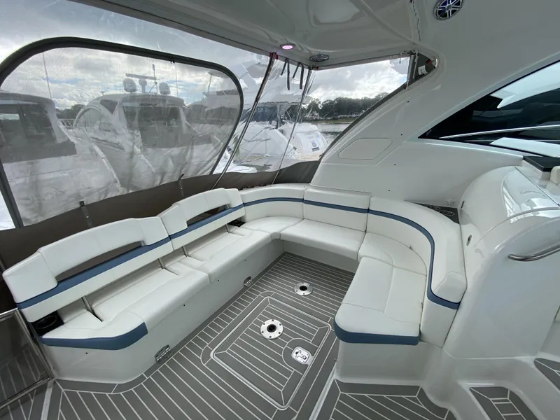 Slide: The Image of Interior of a 2018 Formula 45 Yacht with sleek white seating. - 13
