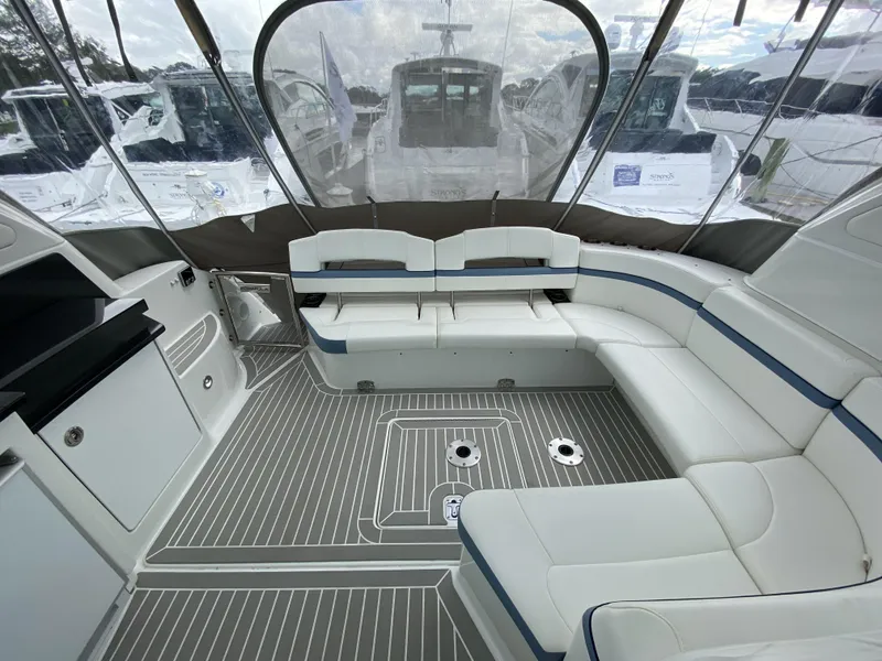 Slide: The Image of Interior of a 2018 Formula 45 Yacht with sleek white seating. - 14