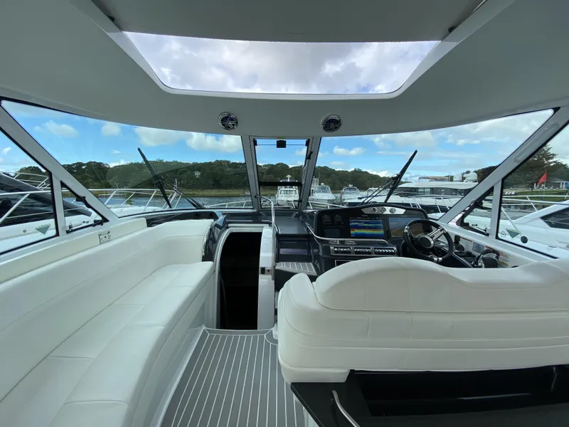 Slide: The Image of Interior of a 2018 Formula 45 Yacht with luxurious white seating. - 18