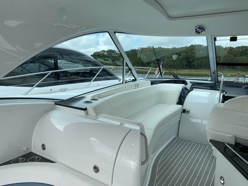 Slide: The Image of Interior of a 2018 Formula 45 Yacht with white seating. - 19