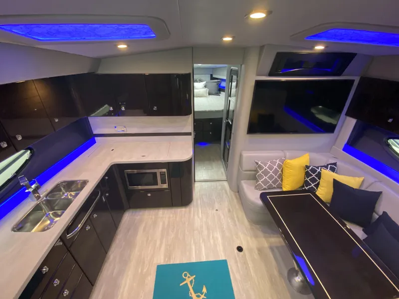Slide: The Image of Interior of 2018 Formula 45 Yacht with modern kitchen and seating area. - 24