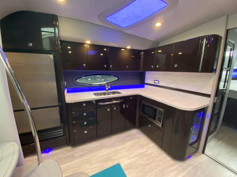 Slide: The Image of Modern kitchen in a 2018 Formula 45 Yacht with sleek lighting. - 28