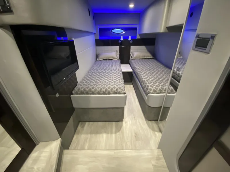 Slide: The Image of Interior of 2018 Formula 45 Yacht with twin beds and blue lighting. - 44