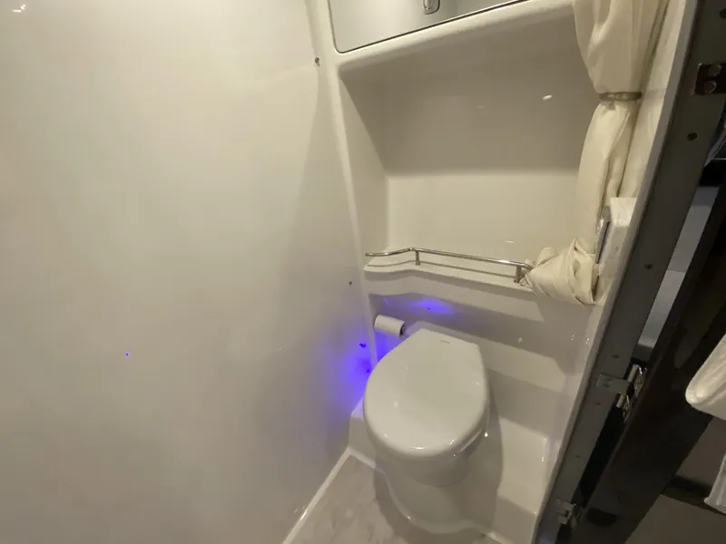 Slide: The Image of Bathroom in 2018 Formula 45 Yacht with toilet and blue lighting. - 45
