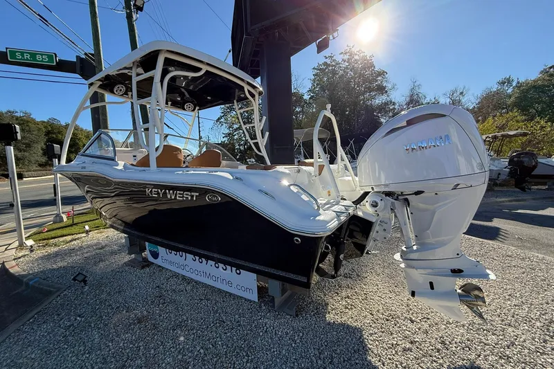 Slide: The Image of 2026 Key West 239 DFS boat with Yamaha engine displayed outdoors. - 1