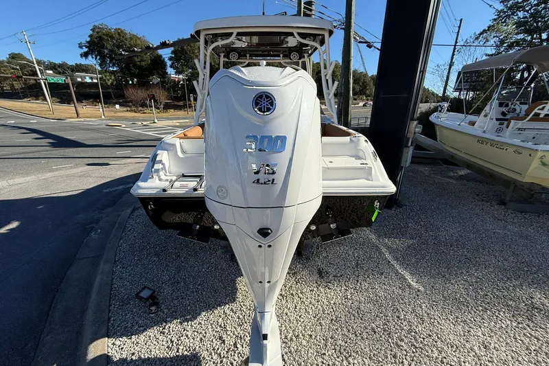 Slide: The Image of 2026 Key West 239 DFS boat with Yamaha 300 V6 engine, displayed outdoors. - 2