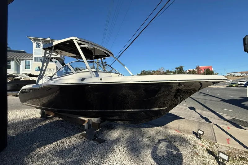 Slide: The Image of 2026 Key West 239 DFS boat displayed outdoors on gravel lot. - 4