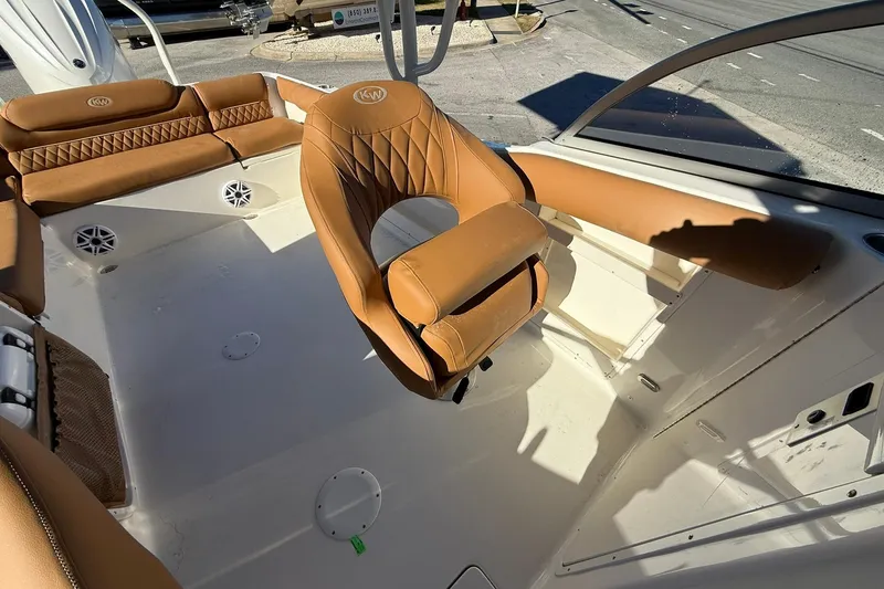 Slide: The Image of 2026 Key West 239 DFS boat interior with tan leather seating and modern design. - 8