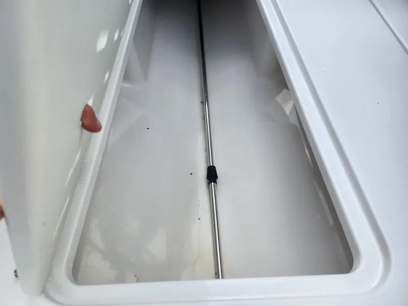 Slide: The Image of 2016 Glastron GT 205 storage compartment interior view. - 12