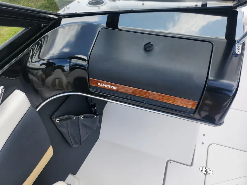 Slide: The Image of 2016 Glastron GT 205 boat interior with sleek dashboard design. - 13