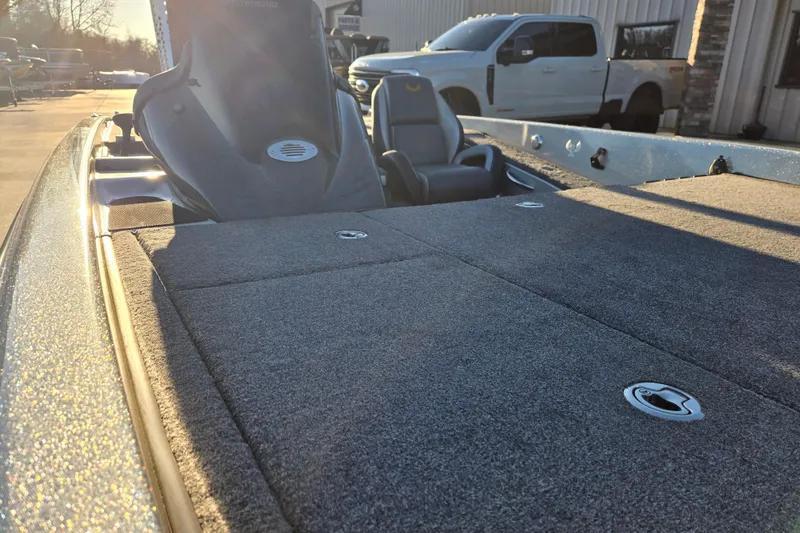 Slide: The Image of 2020 Phoenix 921 Elite boat interior with carpeted deck and seating. - 14