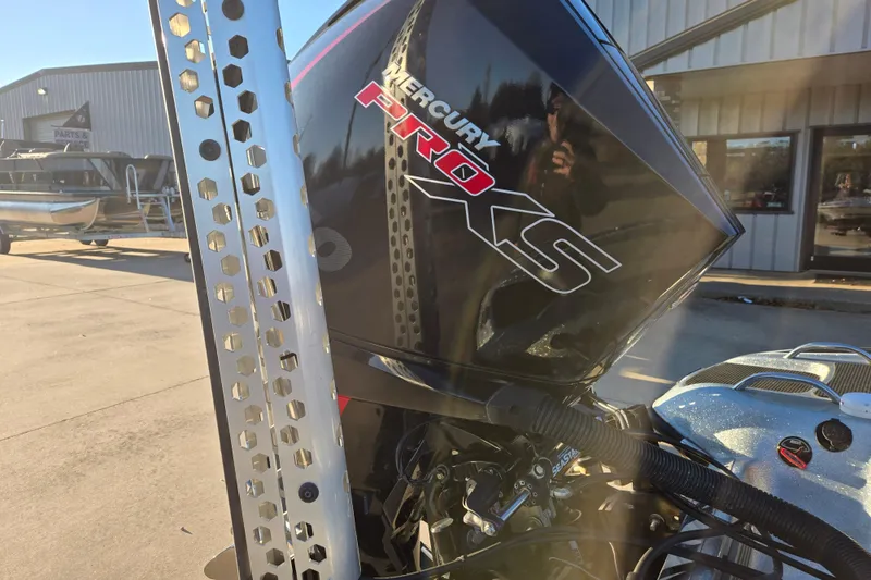 Slide: The Image of 2020 Phoenix 921 Elite with Mercury Pro XS engine in a sunny outdoor setting. - 18