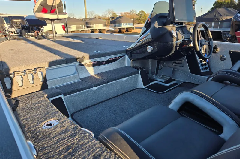 Slide: The Image of 2020 Phoenix 921 Elite boat interior with steering console and seating. - 19