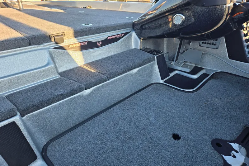 Slide: The Image of Interior of 2020 Phoenix 921 Elite boat with carpeted flooring and control panel. - 20