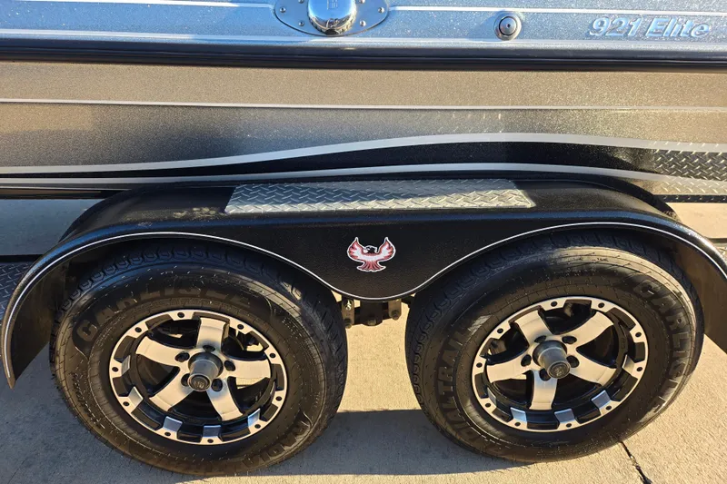 Slide: The Image of 2020 Phoenix 921 Elite boat trailer with dual wheels and sleek design. - 4